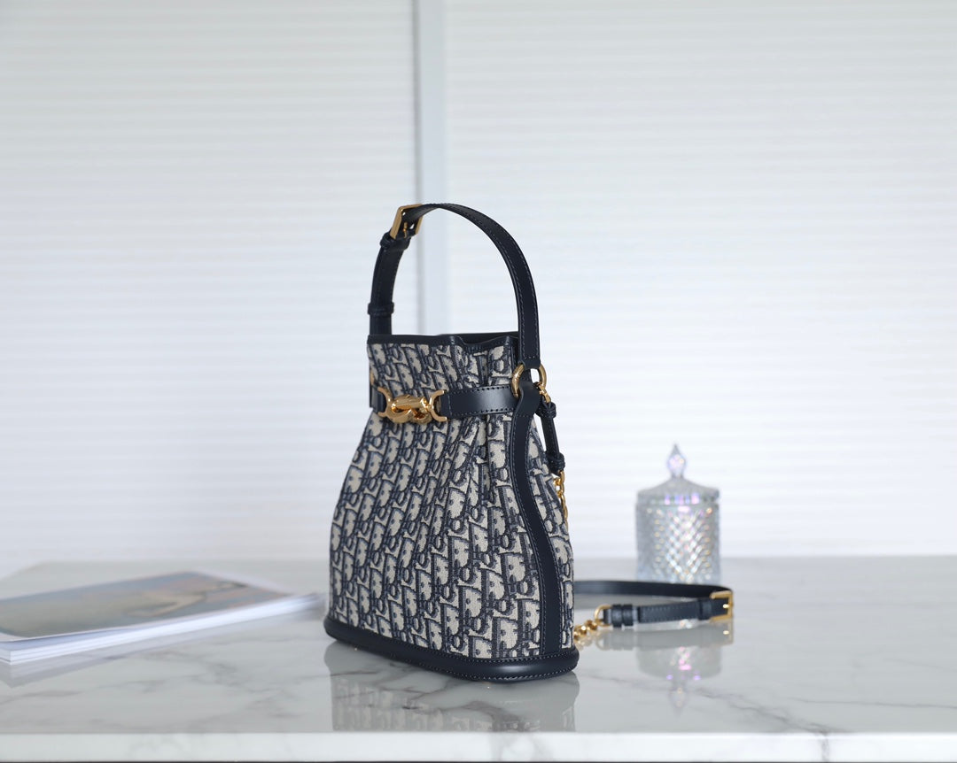 MONTAIGNE MEDIUM 24 BUCKET BAG IN BLUE OBLIQUE JACQUARD CALFSKIN