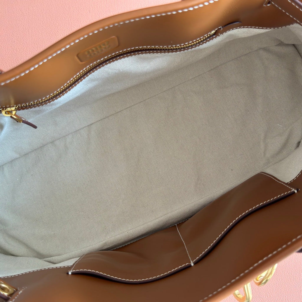 M*u*M*u Aventure Handbag 44 Beige in Canvas