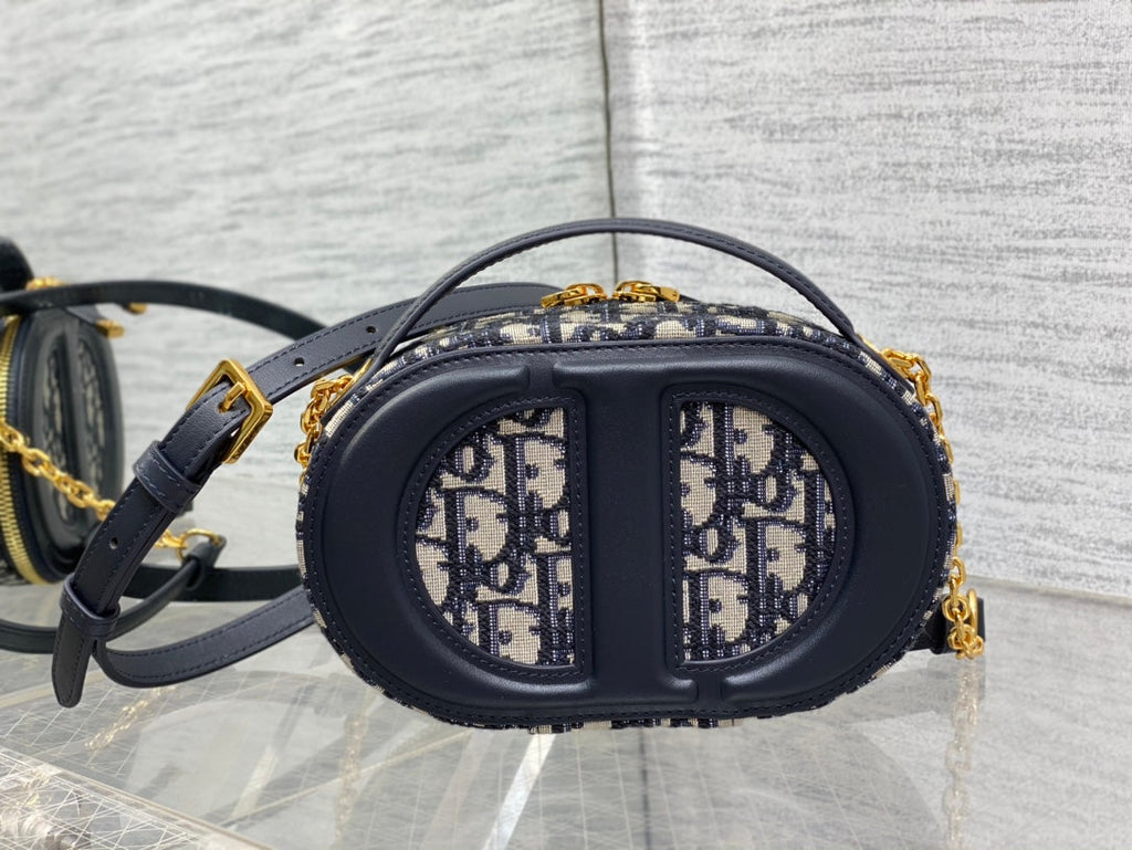 C*D Oval camera bag 18 blue monogram cowhide leather