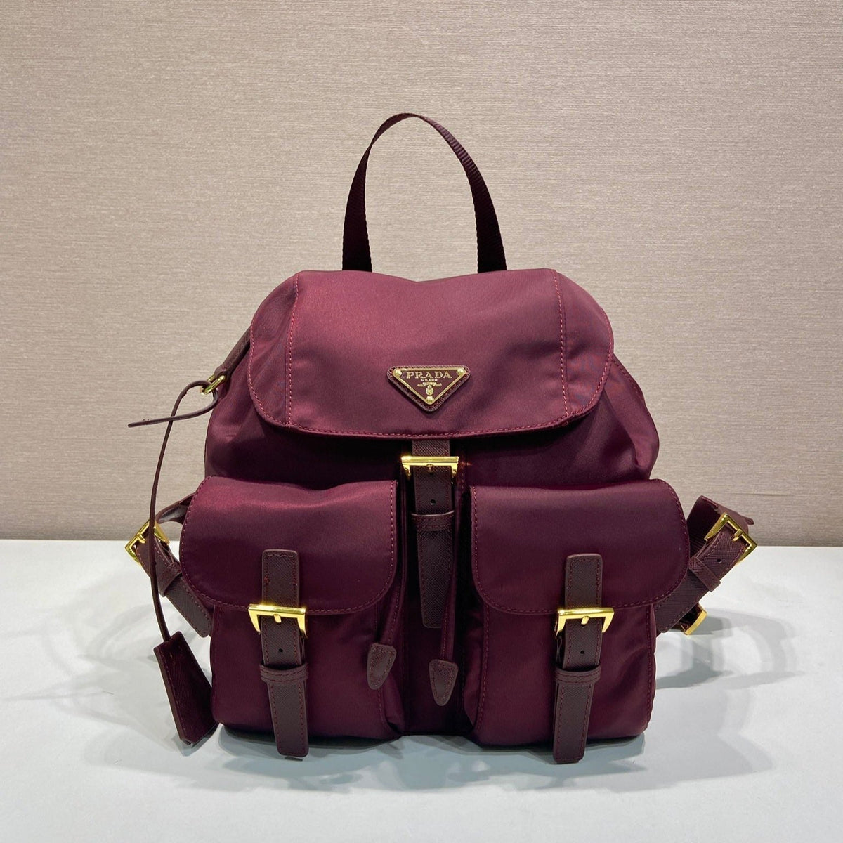 Pr*a backpack 28 burgundy nylon fabric gold hardware