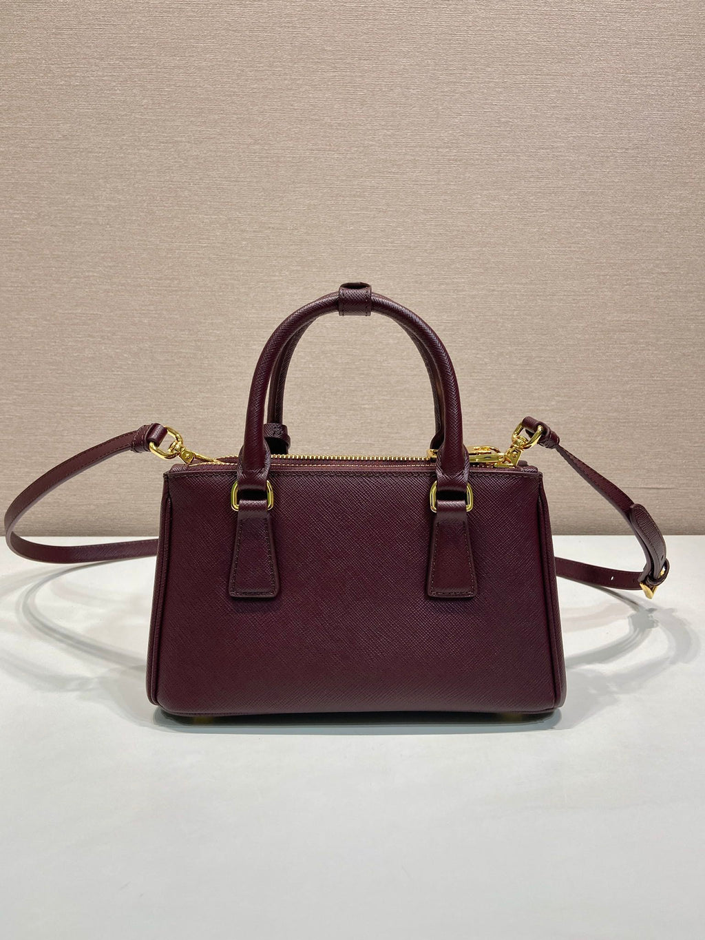 Pr*a Galleria handbag 21 burgundy leather