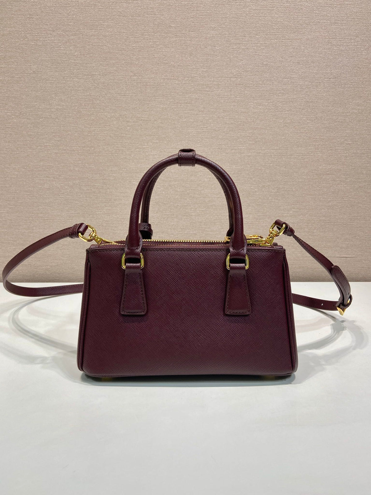 Pr*a Galleria handbag 21 burgundy leather