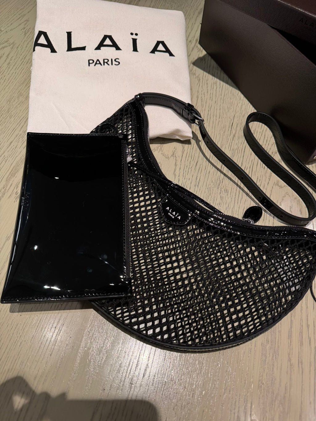 ONE PIECE DEMI LUNE BAG 31 IN BLACK FISHNET