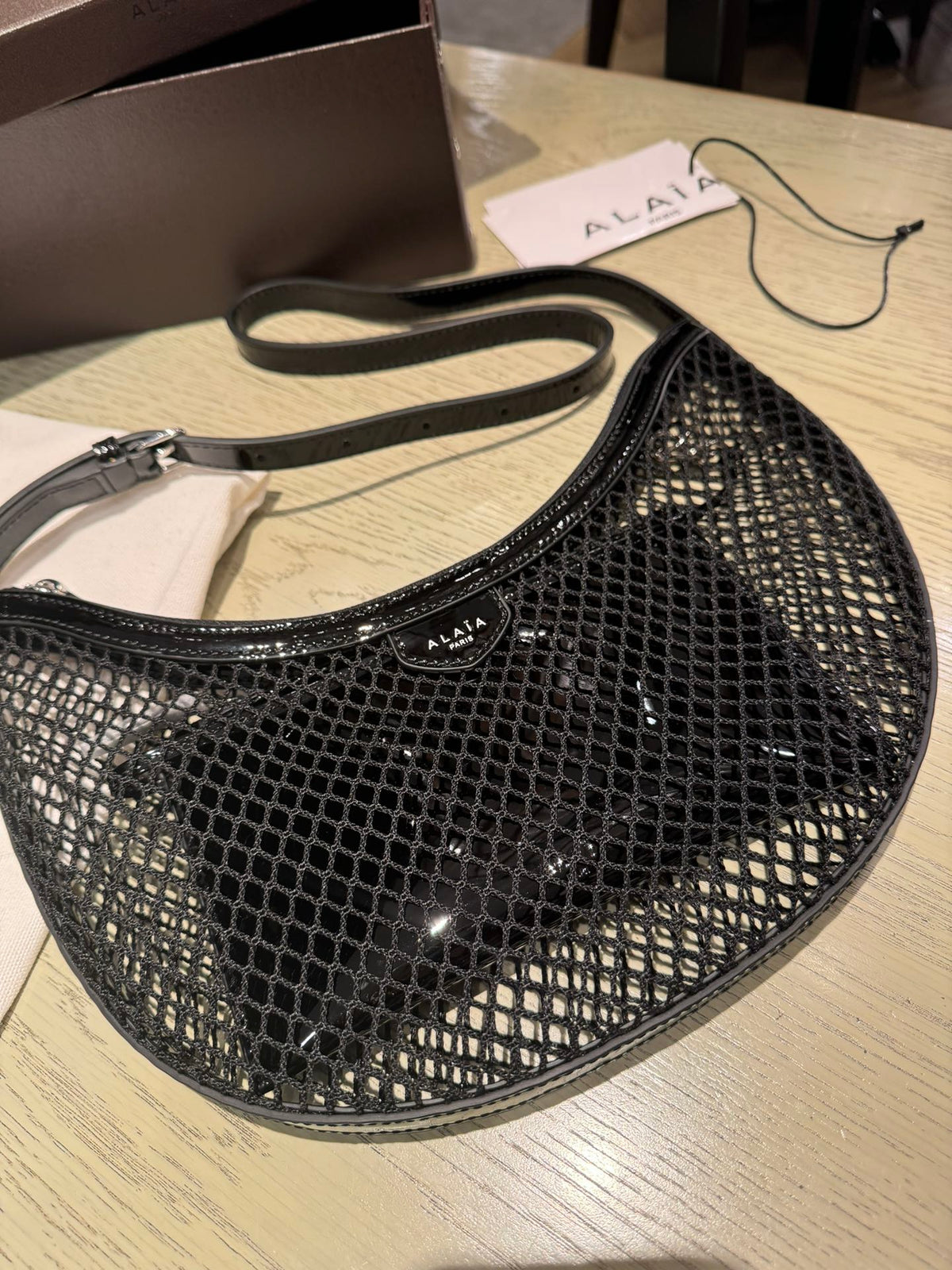 ONE PIECE DEMI LUNE BAG 31 IN BLACK FISHNET
