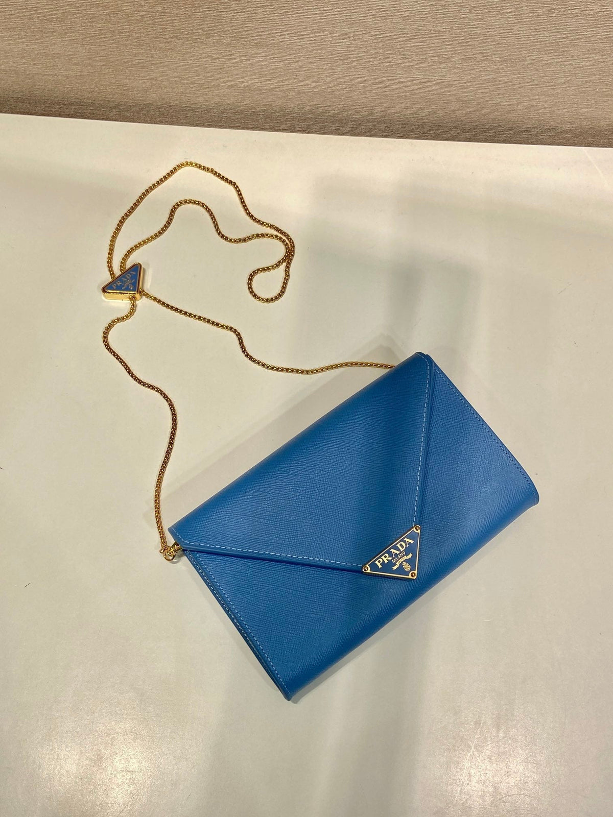 Pr*a Cross pattern envelope bag leather